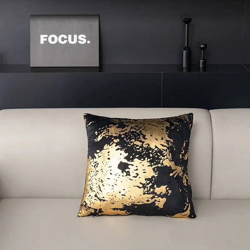 Pair of Nordic-inspired geometric plush pillowcases with a luxurious gold pattern on a white and black background