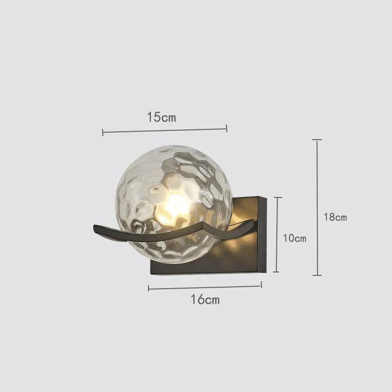 Modern black iron wall lamp with clear glass shade and LED lighting for a sophisticated look