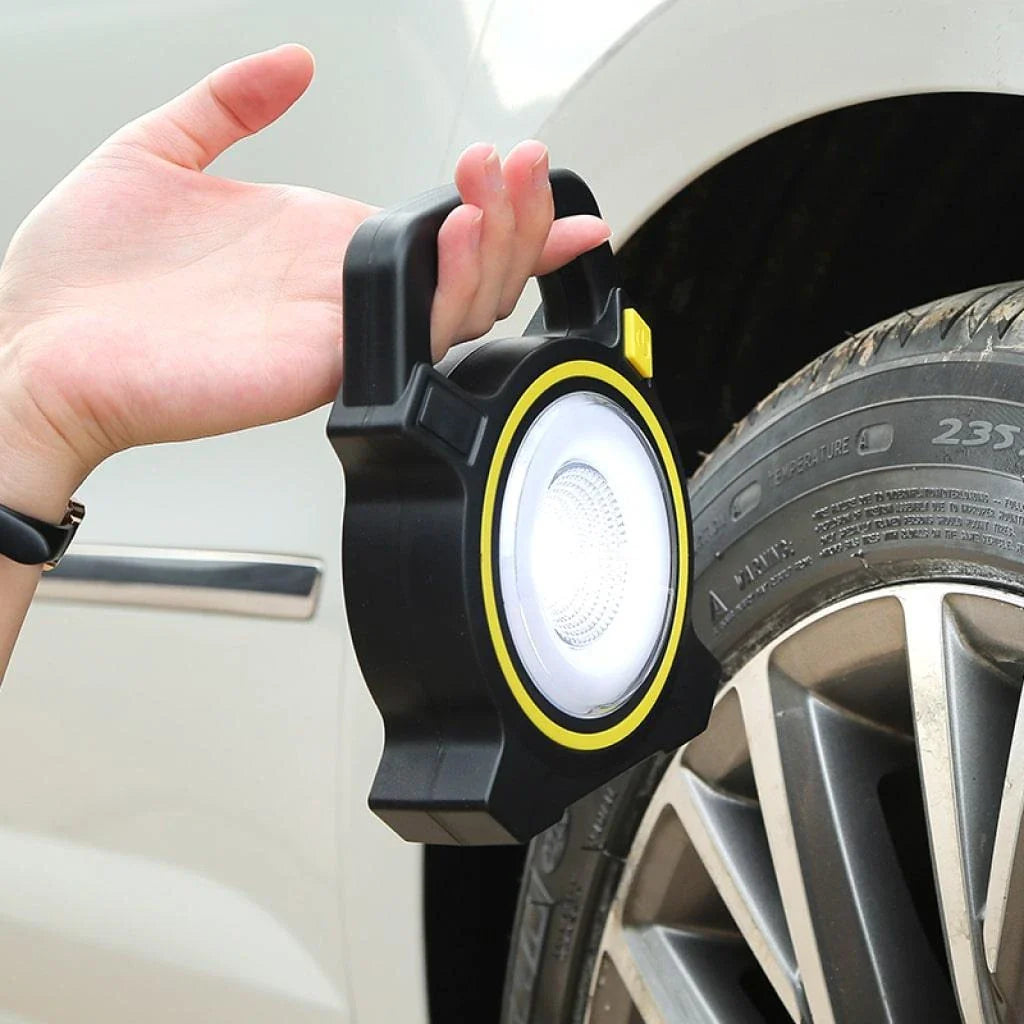 Portable USB-Rechargeable LED Work Lamp with bright LED beam, compact and lightweight design for easy portability, and USB charging capabilities