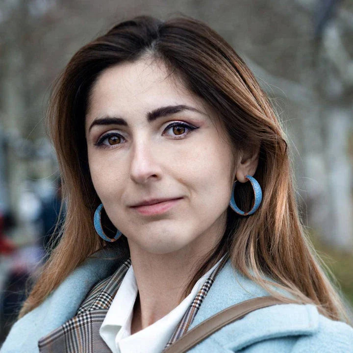 Pair of stunning blue gemstone drop earrings with a regal crown design, inlaid with shimmering zircon stones