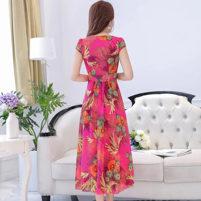 A graceful chiffon dress with short sleeves and a floor-sweeping hem, featuring a delicate printed pattern for a sophisticated, elegant look.