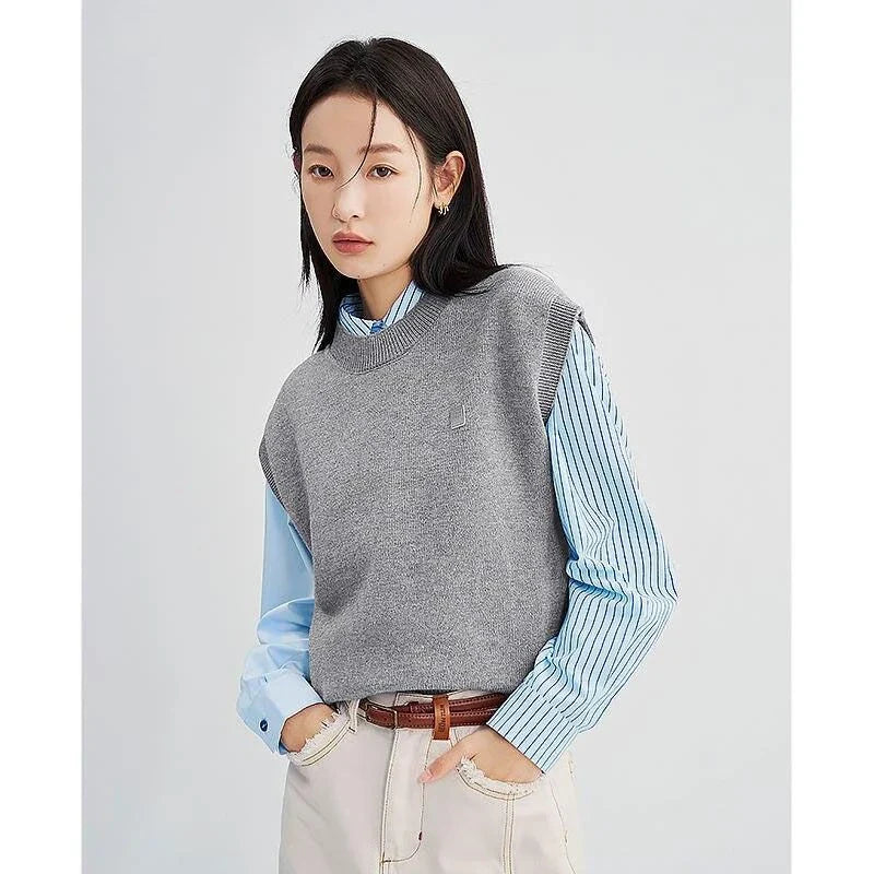 A cozy and chic knitted sleeveless vest in various colours, featuring a straight silhouette and a blend of premium materials for warmth and comfort.