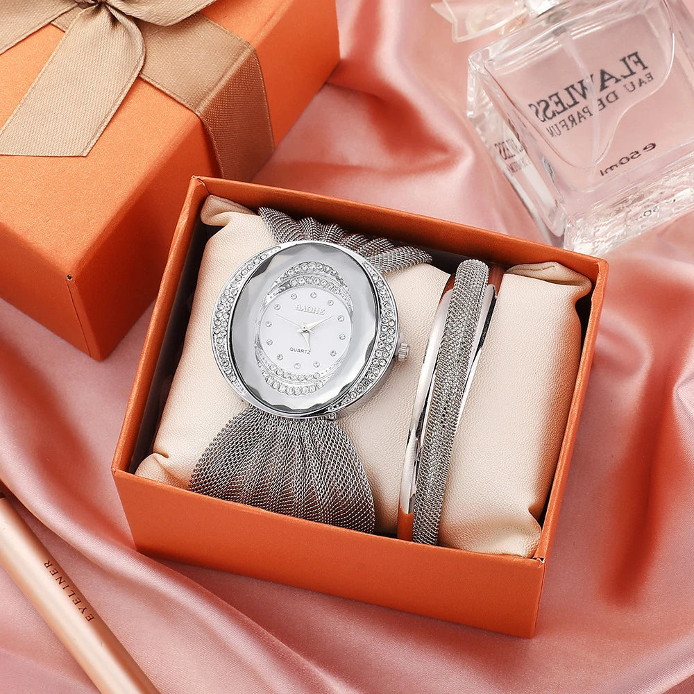 Elegant women's wrist watch with a floral dial design and a gleaming gold and silver mesh strap