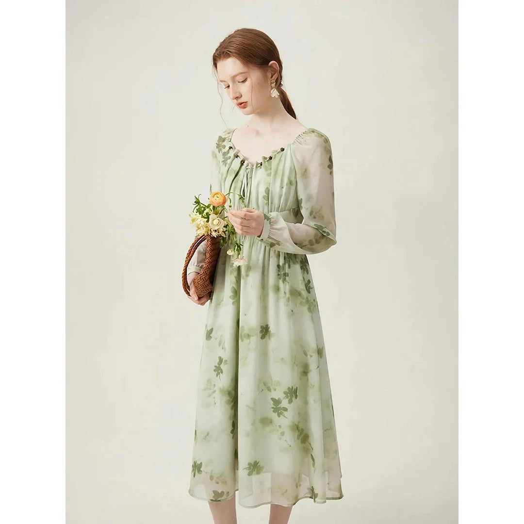 Elegant Chinese-style dress with empire waistline, full-length sleeves, and midi length for a timeless, sophisticated look.