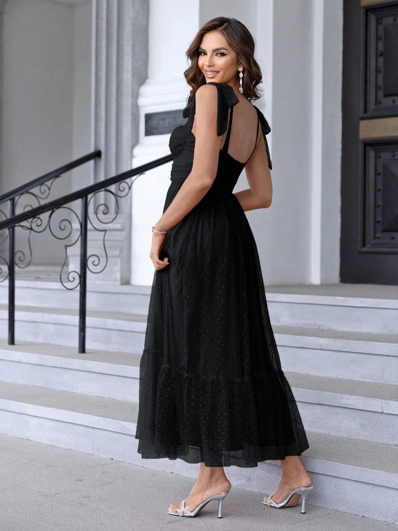 Enchanting fairy-style dress with flowing silhouette, delicate lace accents, and mid-length skirt in a classic black colour