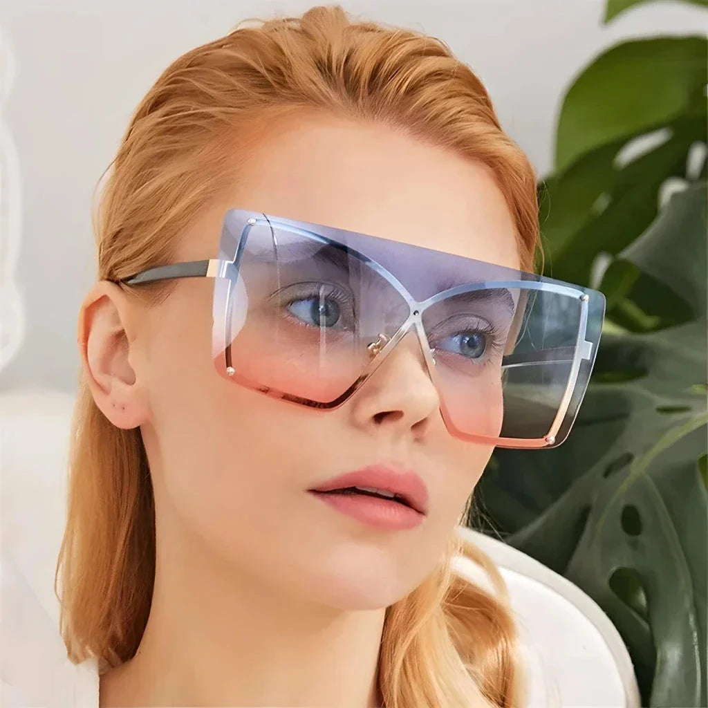 Stylish oversized flat top sunglasses with a rimless design, providing UV protection and a comfortable fit for the modern British woman