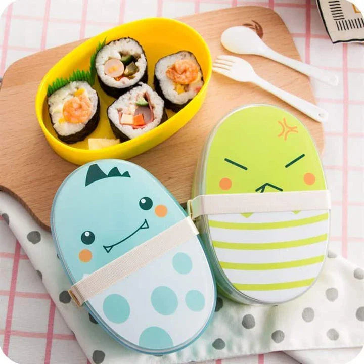 Egg-shaped children's lunch box in various colours, including black, green, blue, and yellow