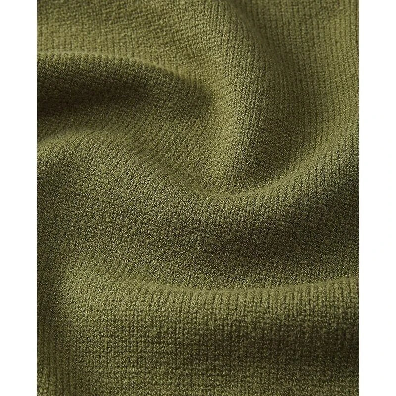 A cozy and chic knitted sleeveless vest in various colours, featuring a straight silhouette and a blend of premium materials for warmth and comfort.