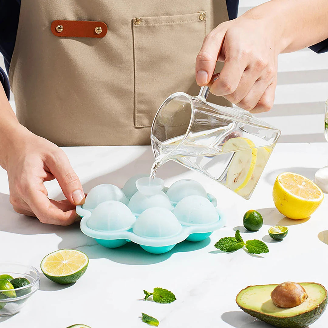 Spherical silicone ice mould with seven holes for creating elegant ice spheres to chill premium drinks