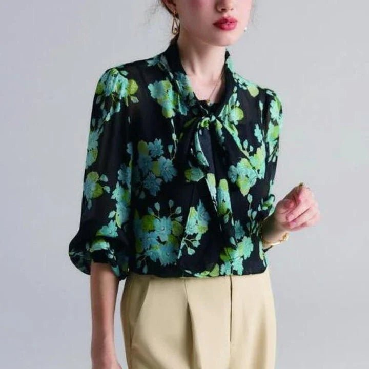 Elegant floral silk blend blouse for women featuring a bow collar, puff sleeves, and a flattering straight-cut silhouette