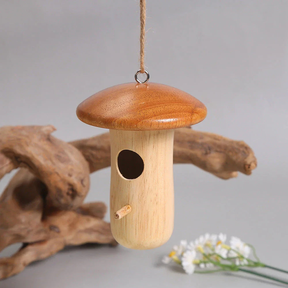 A charming wooden hummingbird nest designed for outdoor gardens, providing a safe and cozy home for these delightful birds.