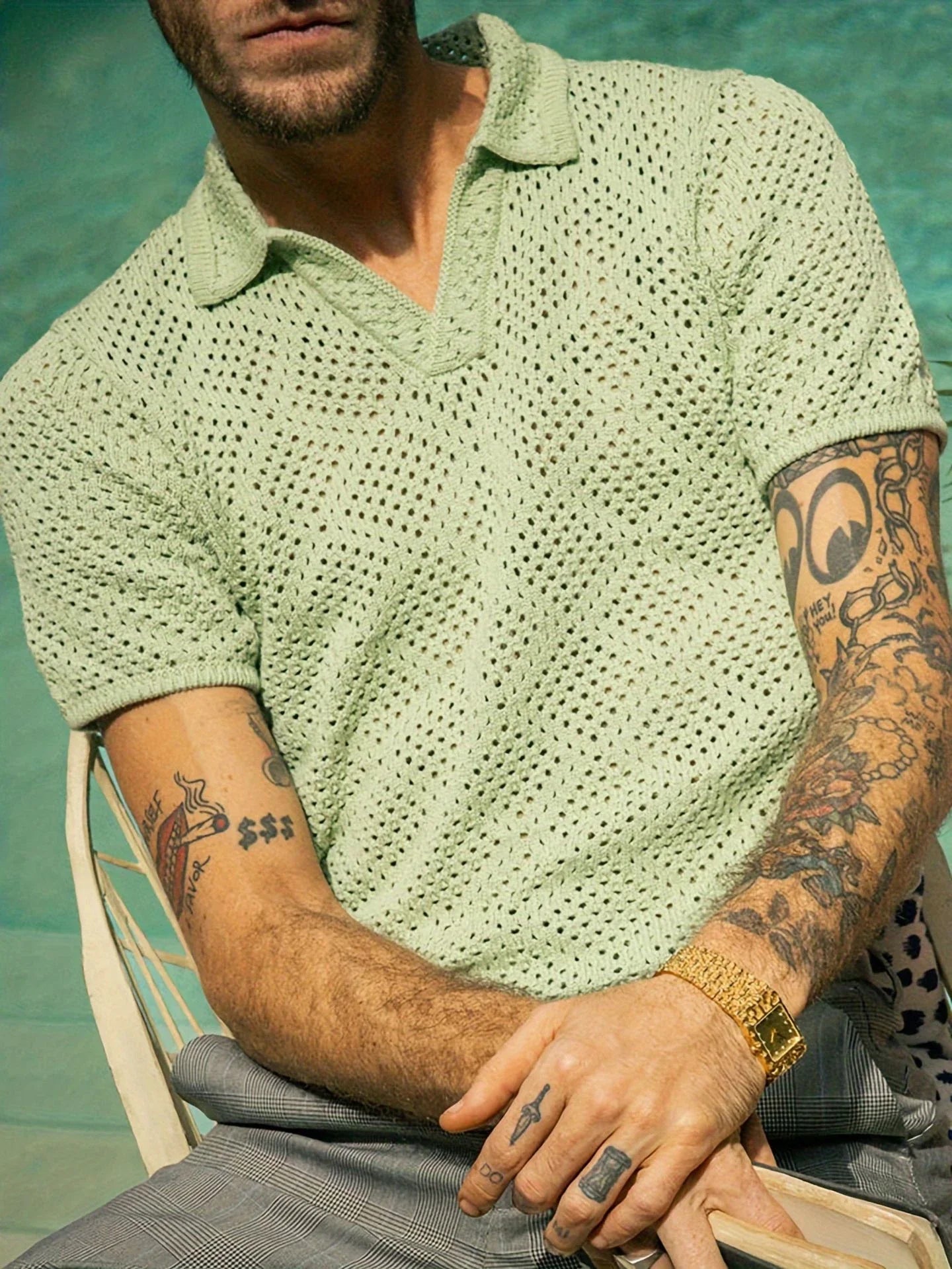 A stylish and comfortable men's knitted shirt in a classic British design, made from premium polyester fabric for breathability and softness.