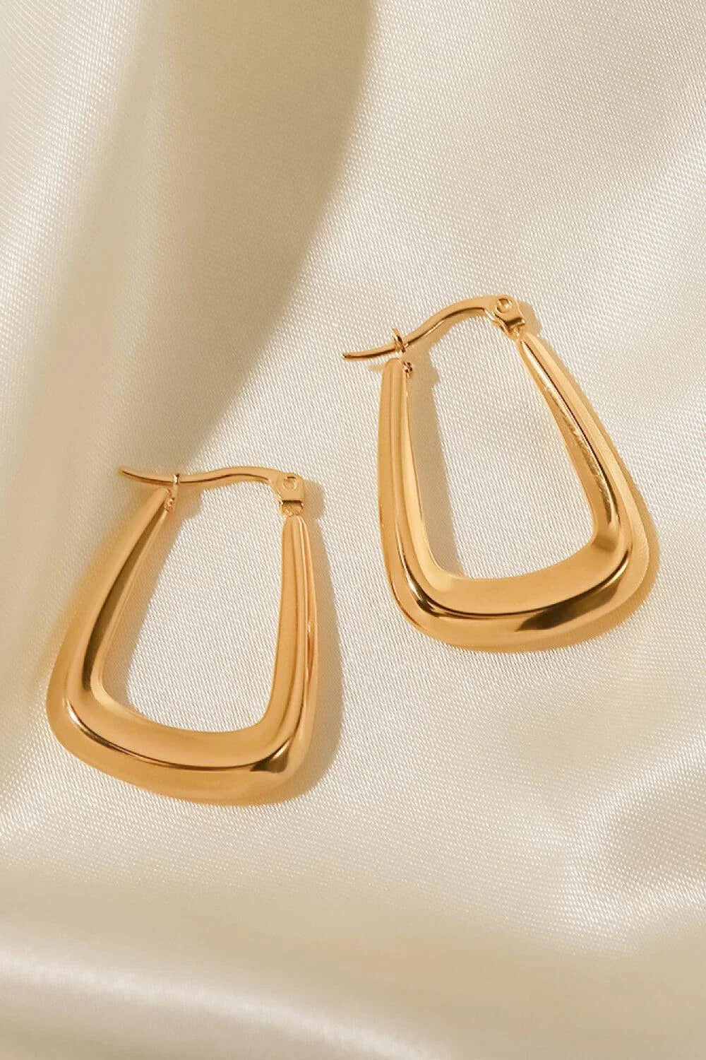A pair of 18K gold-plated geometric earrings with a sleek and modern design