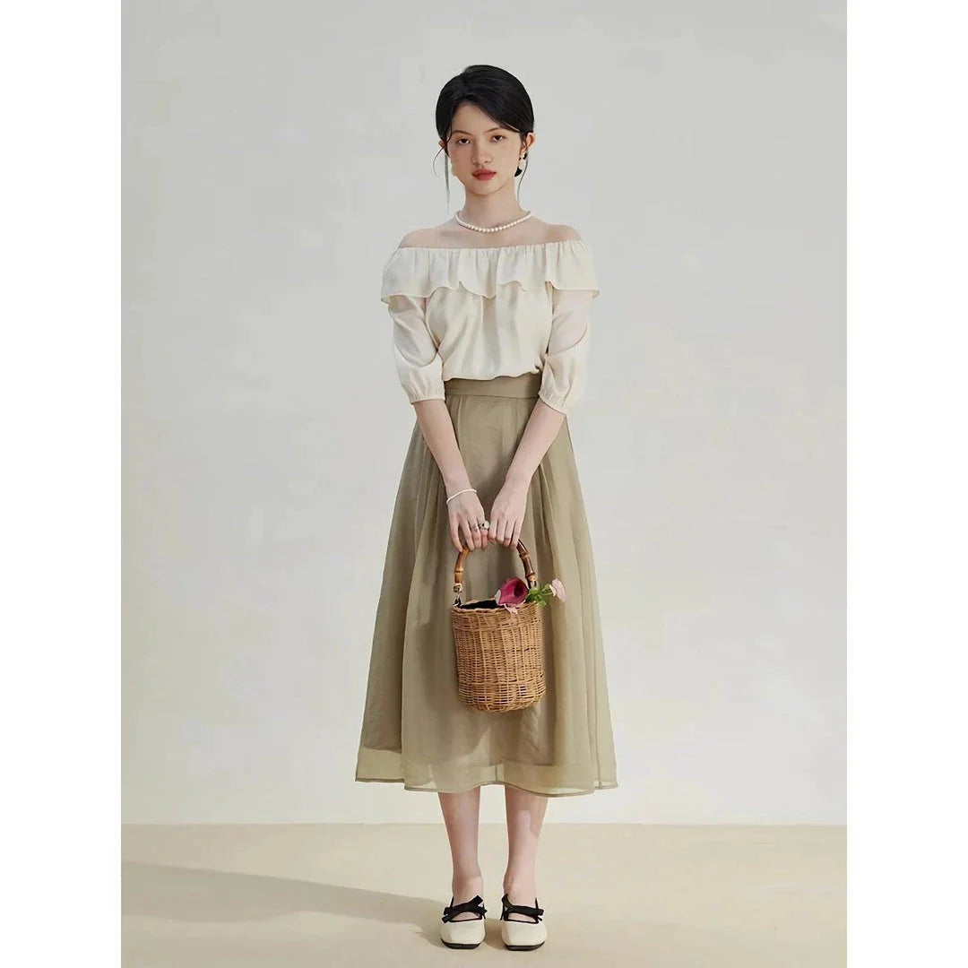 Elegant high-waist a-line midi skirt in a solid, vibrant colour for professional and social wear