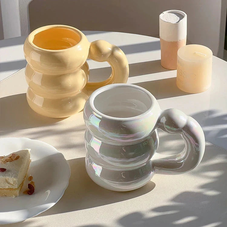Charming ceramic coffee mug with a circular bubble design in a light blue colour, perfect for morning beverages in the UK