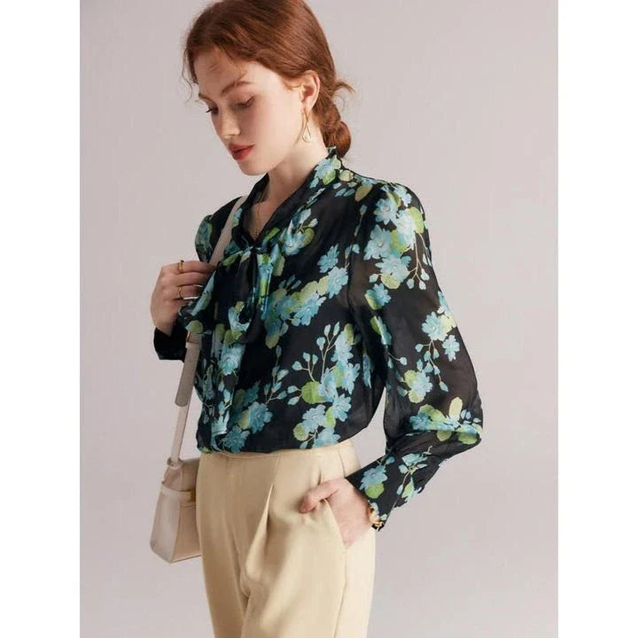 Elegant floral silk blend blouse for women featuring a bow collar, puff sleeves, and a flattering straight-cut silhouette