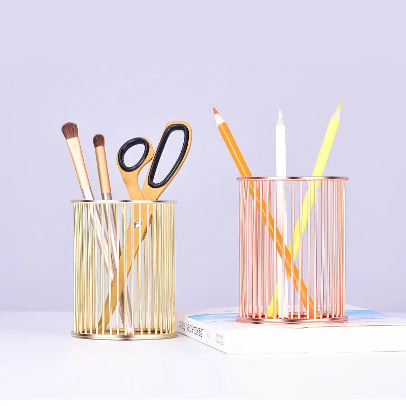 Rose gold plated pen holder with a sleek, minimalist design for organising pens, makeup brushes, and other desk accessories