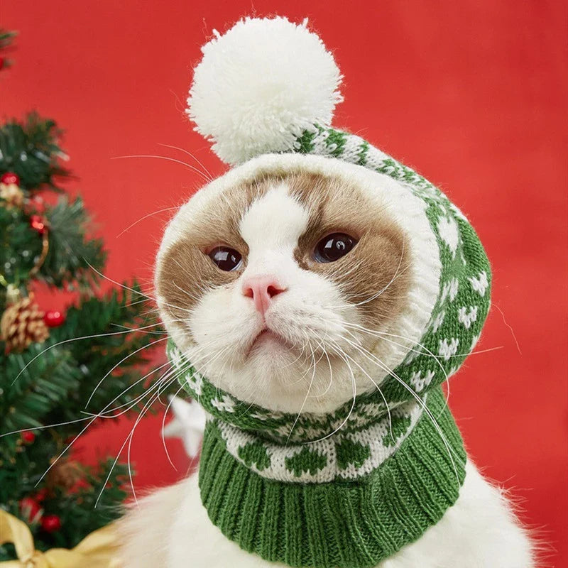 A cosy, knitted pet hat in a festive snowflake and reindeer design, available in various sizes to fit dogs and cats.