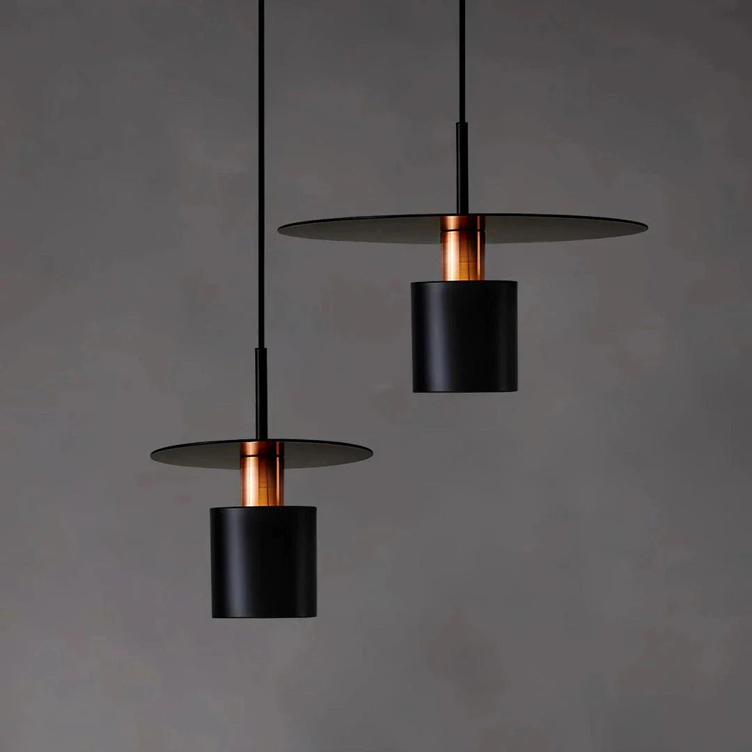A modern and elegant minimalist pendant light made of durable metal with a smooth painted finish, providing focused and cosy illumination for a variety of interior spaces.