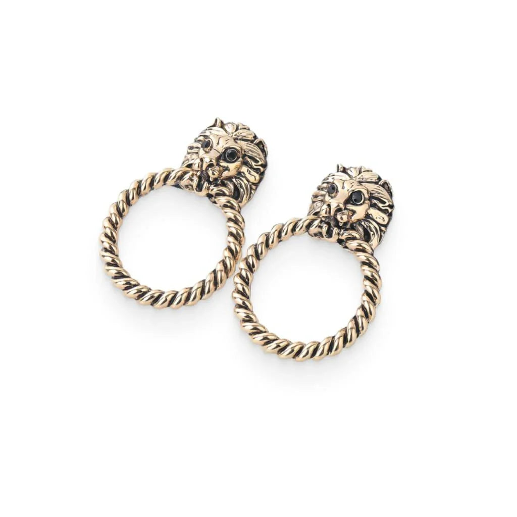 Close-up of the magnificent lion head stud earrings with a twisted hoop design, exuding power and confidence.