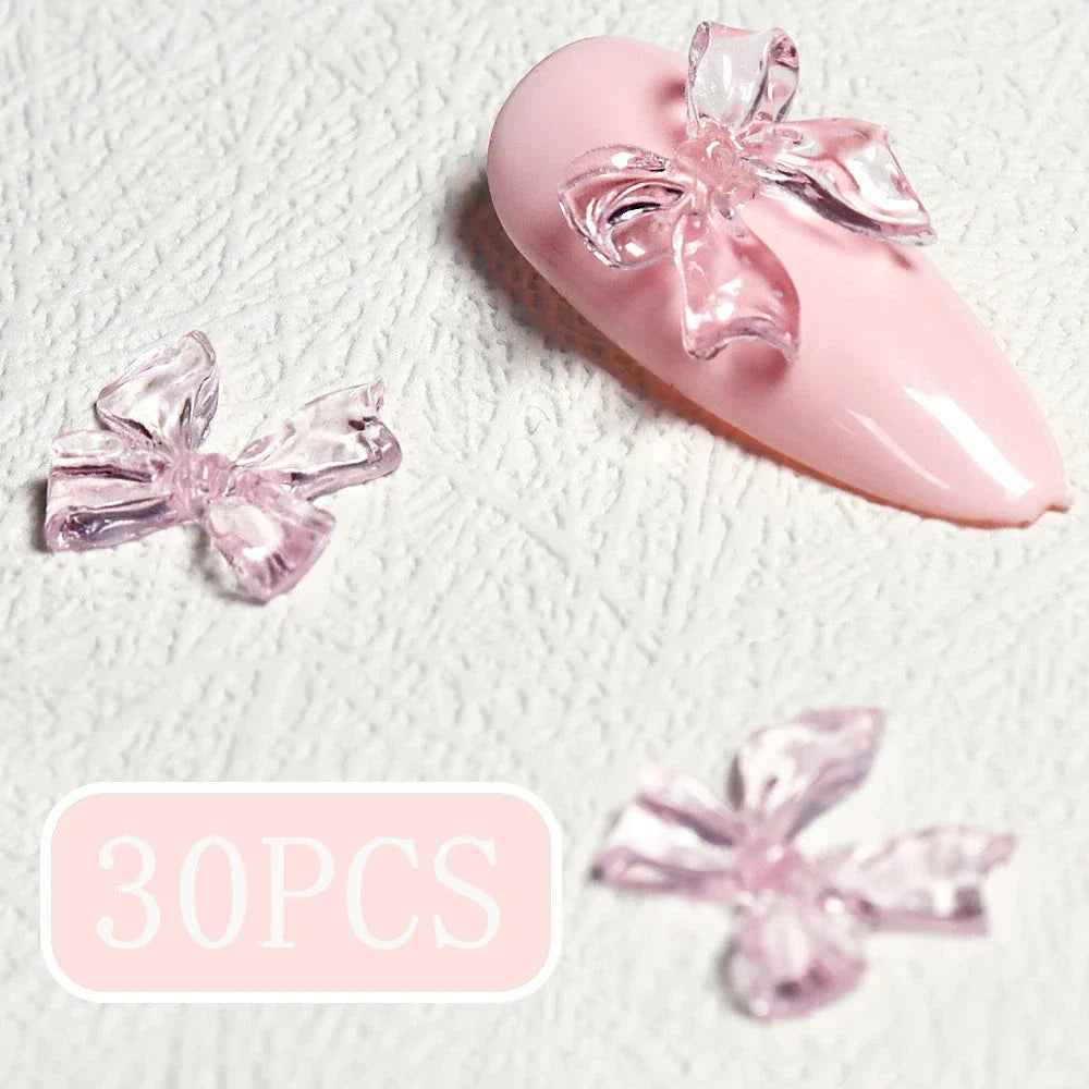 Charming candy-coloured bow nail charms in various colours, perfect for adding a playful touch to your manicure
