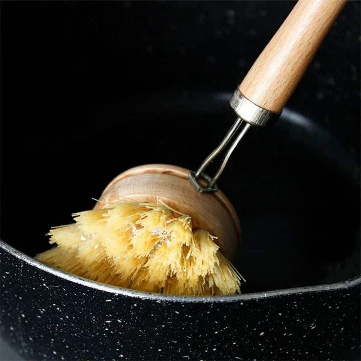 A set of eco-friendly kitchen cleaning brushes with wooden handles and sisal bristles, designed for effective and sustainable cleaning.