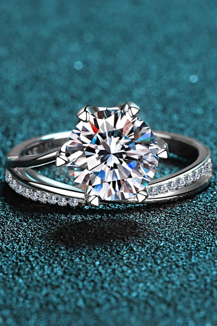 Elegant moissanite flower-shaped split shank ring made with 925 sterling silver and platinum-plated accents