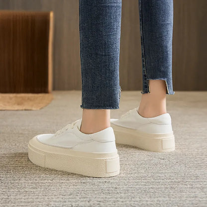 Women's black platform casual shoes with round toe and tied laces on a rubber sole.