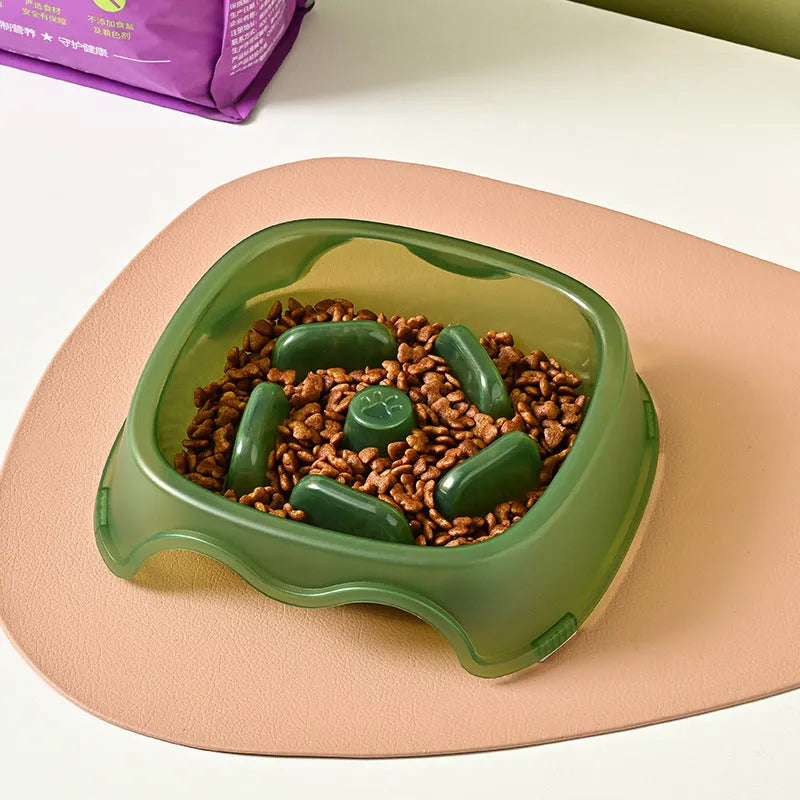 Blue plastic anti-choke slow feeder bowl for dogs on a floor