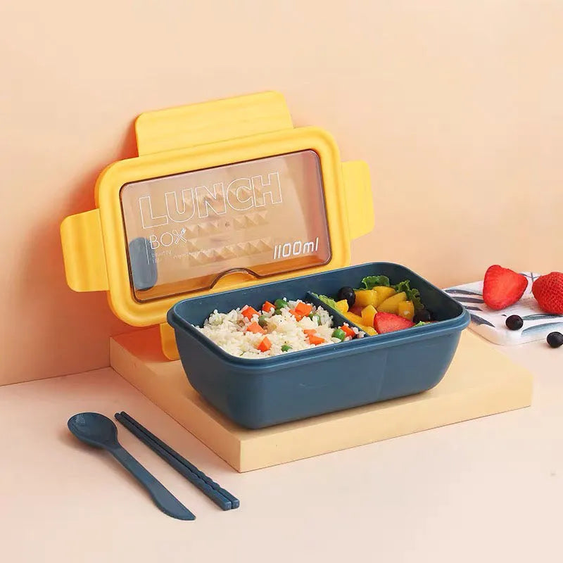 Green four-layer stacked plastic bento box with separate compartments for food, shown next to red and yellow options.