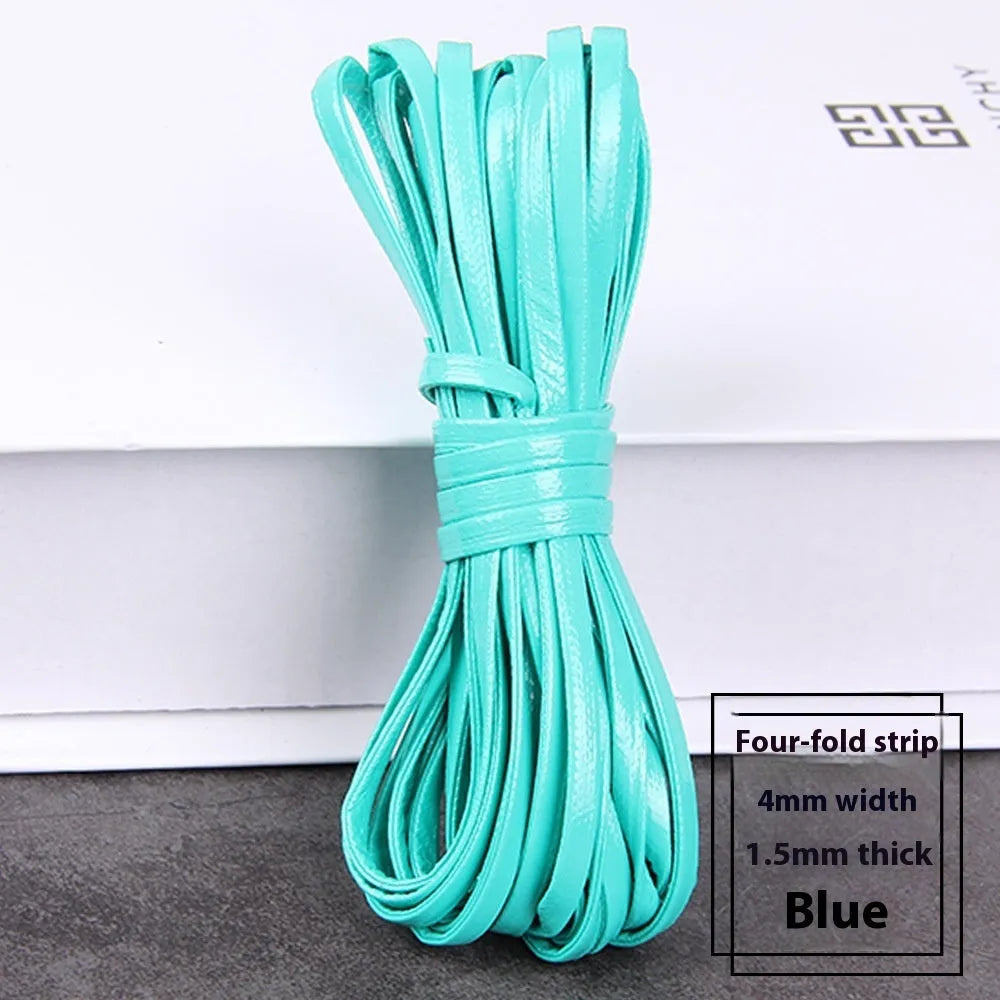 Coiled reels of PU leather craft string in multiple colours including beige, black, red, and blue.