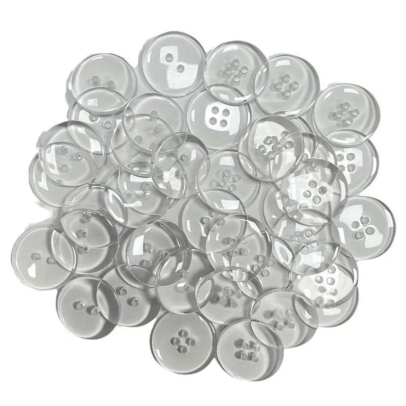 Transparent plastic resin sewing buttons with two holes, 10mm in diameter.