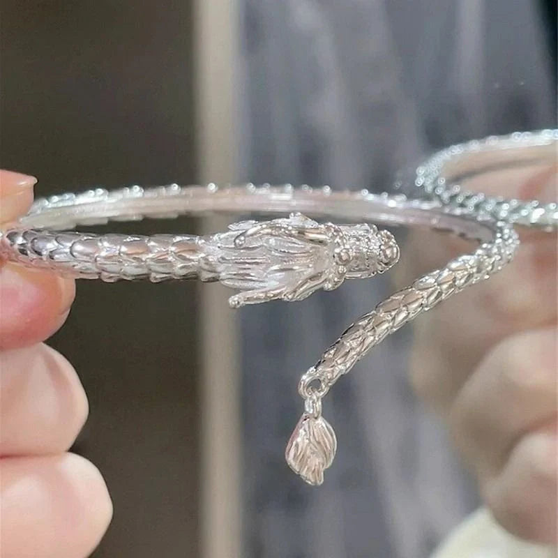 Adjustable Chinese dragon tail bangle with intricate relief design