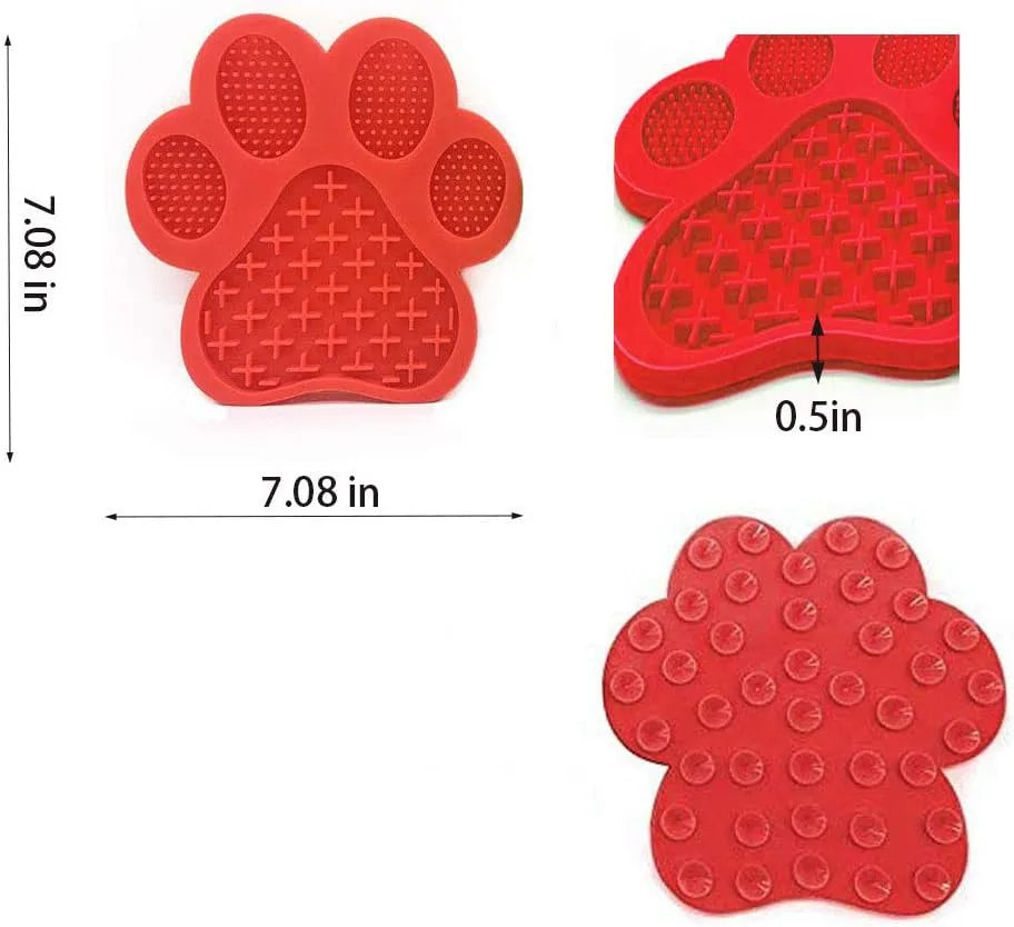 Bone-shaped blue silicone dog licking mat with suction cups on a tile surface