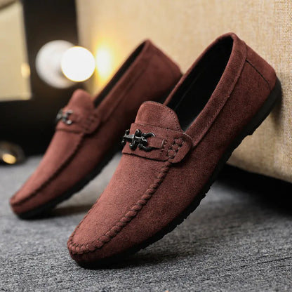 Men's black waterproof slip-on loafers with round toe and low heel on a rubber sole.
