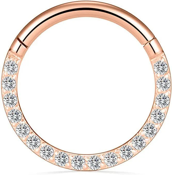 A seamless round hoop nose ring in stainless steel, shown alongside gold and rose gold colour options.