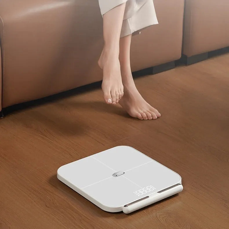 White professional body fat scale with 8 electrodes on a 30x30cm tempered glass platform and LED display