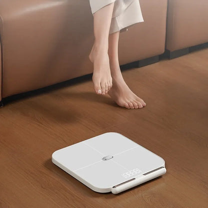 White professional body fat scale with 8 electrodes on a 30x30cm tempered glass platform and LED display
