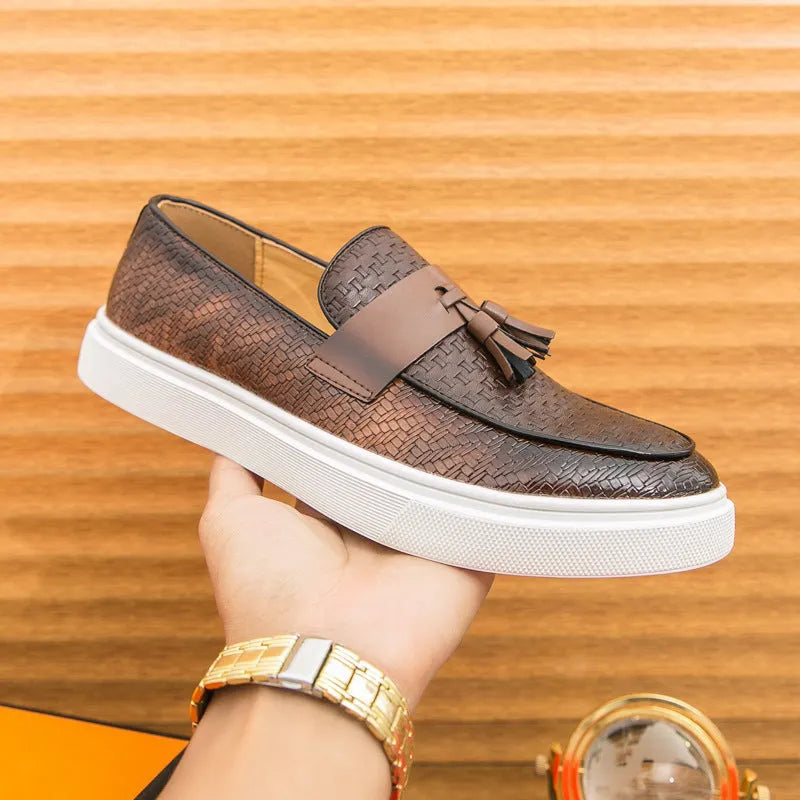 Men's black casual leather shoes with fringe detailing on round toe and low heel