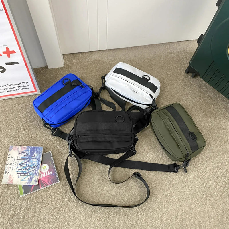 Men's messenger bag made from durable nylon with street trend styling, featuring a 22cm length, 5cm width, and 14cm height for daily use, available in black, blue, green, or white solid colours