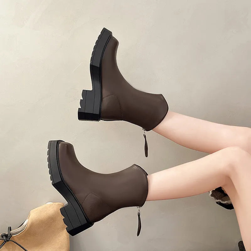 Black platform Martin boots for women with square toe, back zipper, and rubber sole.