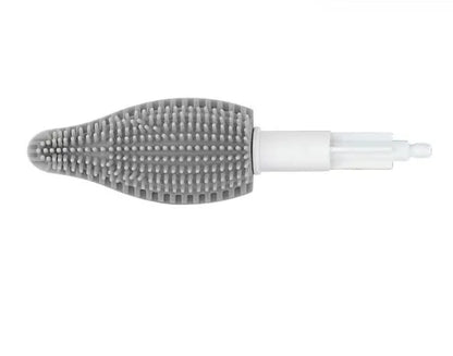 Green electric cleaning brush with multiple brush heads on a kitchen worktop.