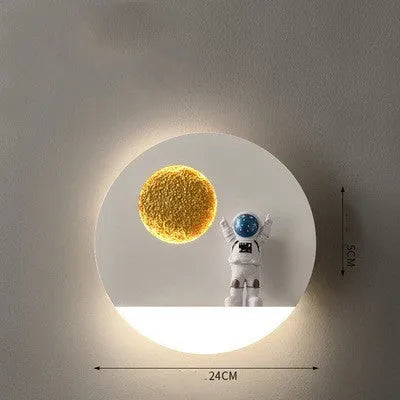 Astronaut-shaped wall lamp with small shelf in black or white finish for bedside placement