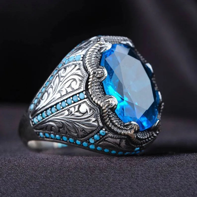 Antique silver geometric alloy ring with blue zircon stones on size chart showing 7-13