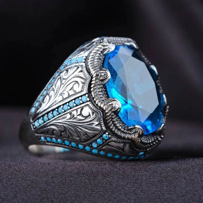 Antique silver geometric alloy ring with blue zircon stones on size chart showing 7-13