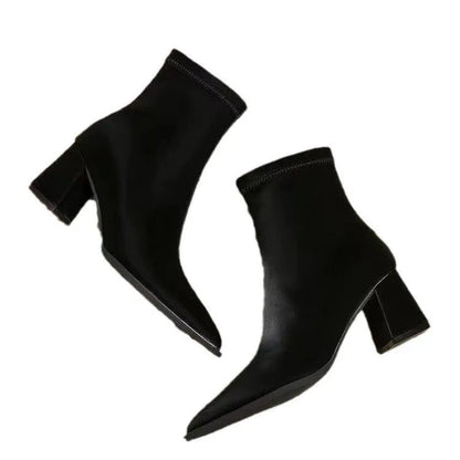 Women's khaki stretch suedette pointed toe ankle boots with a mid block heel on a white background.