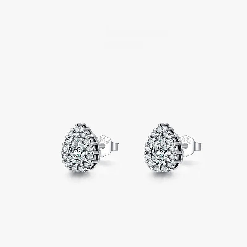 A pair of drop-shaped sterling silver ear studs with a diamond-cut finish.