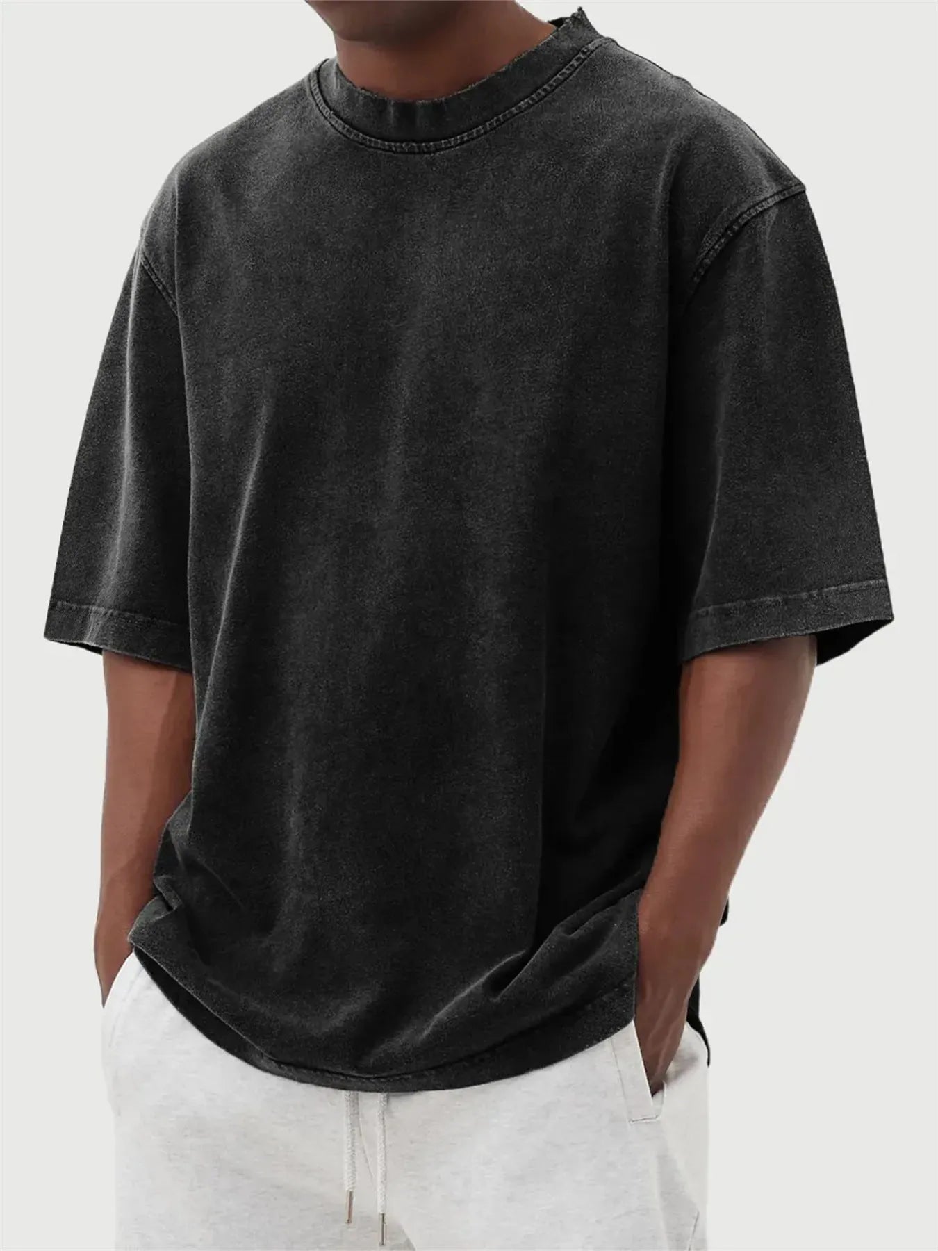 Men's loose fit stone-washed distressed short sleeve t-shirt in solid colour