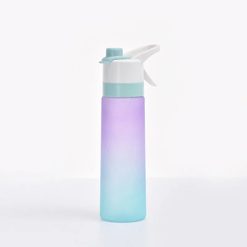 White spray water bottle with black leakproof lid and handle strap on a table