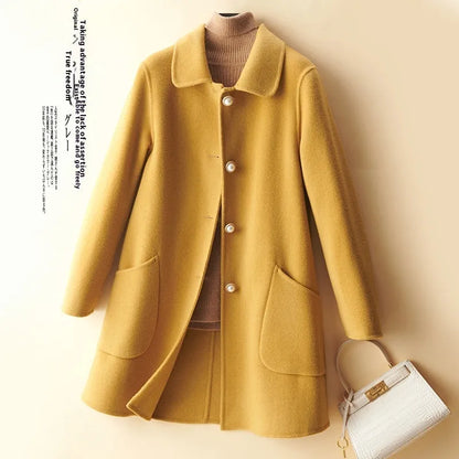 Women's double-faced wool mid-length coat with a doll collar and pearl buckle detail in a solid colour.